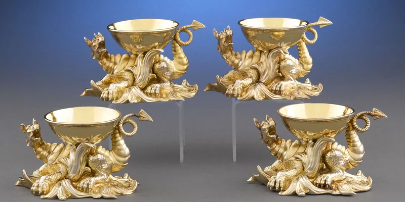 Antique silver salt cellars by R. & S. Garrard, royal silversmiths to the British Crown — a matched pair of Victorian open silver salts on cast paw feet with pierced silver gilding, the classic form of 19th-century English silver salt cellars