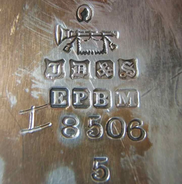 EPBM silver plate mark on a James Dixon & Sons piece — Electroplated Britannia Metal stamp with the maker's bugle trademark and pattern number, punched on the underside of Victorian silver-plated hollowware