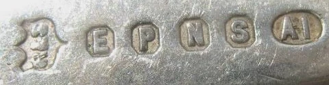 EPNS A1 silver plate quality marks — E, P, N, S in individual cartouches followed by A1, Sheffield's highest plating grade, stamped on the underside of an antique silver-plated piece